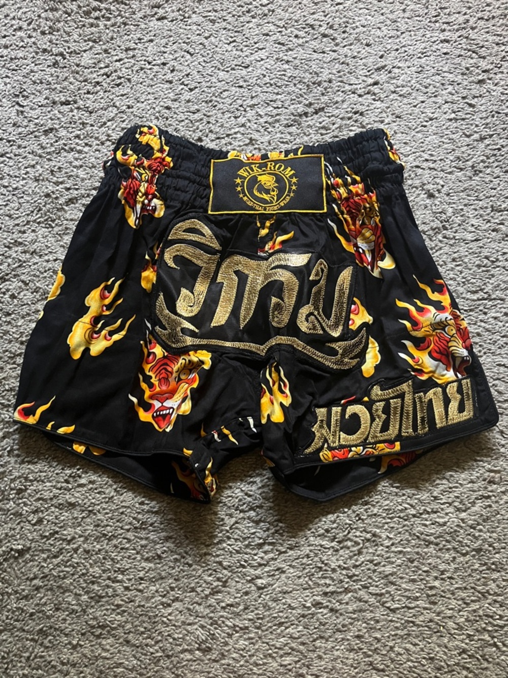 flaming tiger Wik-Rom Muay Thai shorts with gold accent
